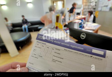 File photo dated 10/09/14 of a registration form at the Temple Fortune Health Centre GP Practice near Golders Green, London. Funding for GP practices has been slashed - with patients now facing longer wait for appointments, according to analysis by the Liberal Democrats. Experts warned that cuts in primary care 'adversely impact' deprived communities and more investment is needed to safeguard the future of general practice. Issue date: Monday January 22, 2024. Stock Photo
