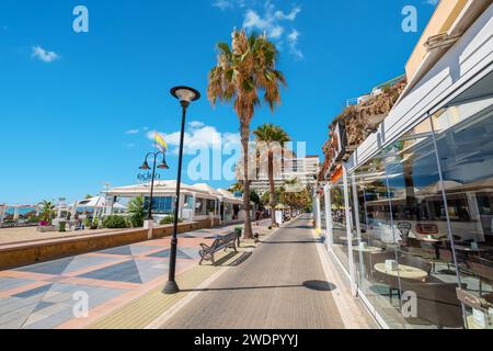 View looking down seaside promenade Paseo de Maritimo in Torremolinos. Andalusia, Spain Stock Photo