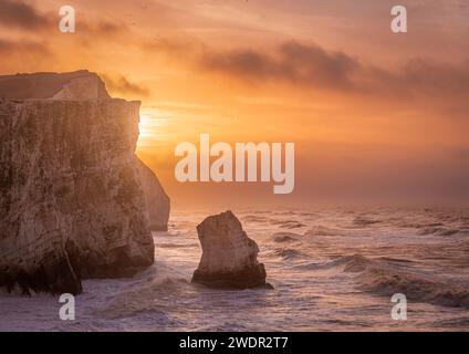 Storm Isha brewing at Seaford head on the east Sussex coast during high tide and sunrise south east England UK Stock Photo