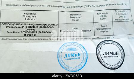 COVID test showing Negative result stumped in a certified laboratory in Kazakhstan. RNA scraping test detecting COVID, PCR test result COVID document Stock Photo