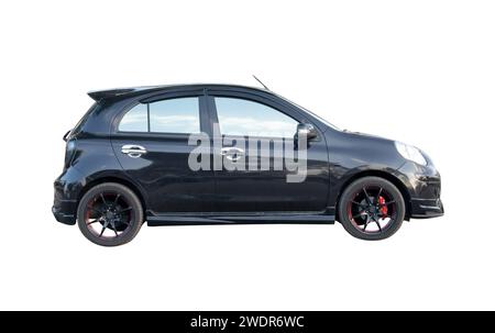 Single lovely small black hatchback car is isolated on white background with clipping path. Stock Photo