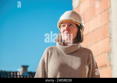 Portrait of female architect on building construction site during inspection procedure, selective focus Stock Photo