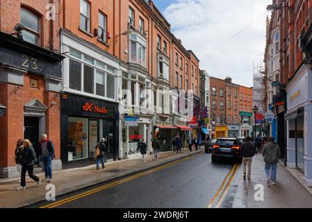 DUBLIN, Ireland - August 05, 2023: Lively street in the city center in a fresh summer morning Stock Photo