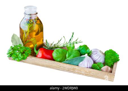 Herbs and oil isolated on white background Stock Photo