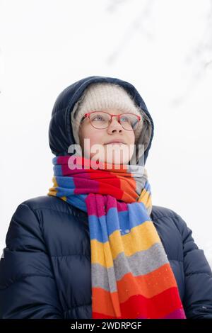 A teenager girl in a warm colored scarf Stock Photo