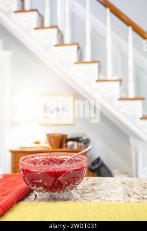 Red Cranberry Sauce in Glass Bowl on Kitchen Counter Stock Photo