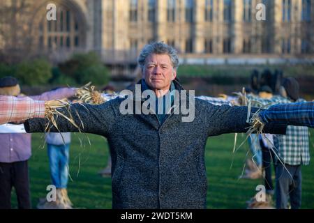 London, England, UK. 22nd Jan, 2024. GUY SINGH-WATSON, founder of Riverford Organic, poses with scarecrows outside British parliament during a protest calling for government the big six supermarkets - Tesco, Sainsbury's, Asda, Morrisons, Aldi and Lidl- to 'get fair about faming. (Credit Image: © Tayfun Salci/ZUMA Press Wire) EDITORIAL USAGE ONLY! Not for Commercial USAGE! Credit: ZUMA Press, Inc./Alamy Live News Stock Photo