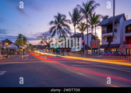 View of palm trees and boutique shops in Grand Bay at dusk, Mauritius, Indian Ocean, Africa Stock Photo