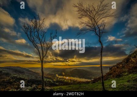 Sunset view from Gummers How in the Lake District, UNESCO World Heritage Site, across Windermere towards the distant Cumbrian Coast Stock Photo