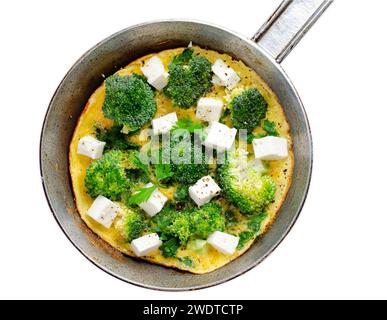 Omelette with Broccoli and Feta Cheese in a Skillet Pan on White Isolated Background Stock Photo