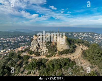 Remains of a 16th-century Begur castle fort atop a forested hill, with panoramic views of the Mediterranean Sea on the Costa Brava Spain Stock Photo