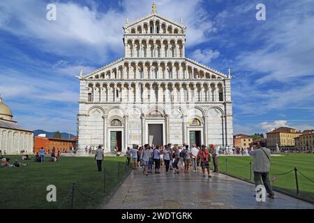 PISA, ITALY - SEPTEMBER 16, 2018: This is a group of tourists in front of the facade of the Cathedral in honor of the Assumption of the Blessed Virgin Stock Photo