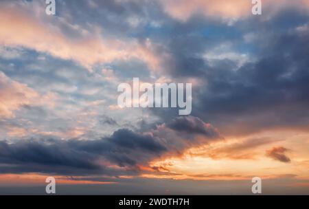 Beautiful sunset sky background with clouds. Stock Photo