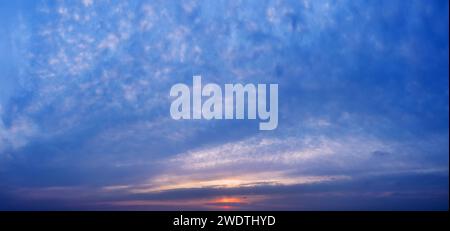 Beautiful colorful sunset sky with clouds. Stock Photo