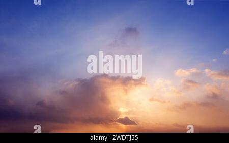 Beautiful sunset sky with pastel colored clouds. Nature background. Stock Photo