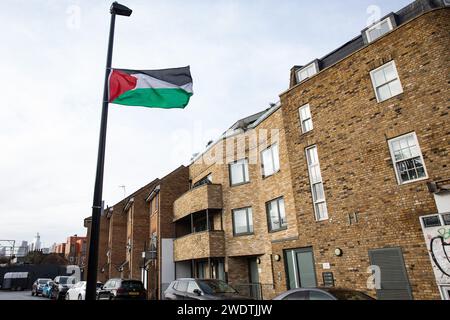London, UK. 21st January, 2024. A Palestinian flag is pictured flying from a lamp post in Tower Hamlets. There are many visible symbols of solidarity with Palestinians in the Tower Hamlets area of London, including pro-Palestinian street art and Palestinian flags. Credit: Mark Kerrison/Alamy Live News Stock Photo