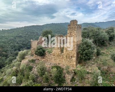 Aerial view of Castell de Vilaroma near Palamos on the Costa Brava, hilltop castle ruin with towers above the valley of St Joan de Palamos Stock Photo