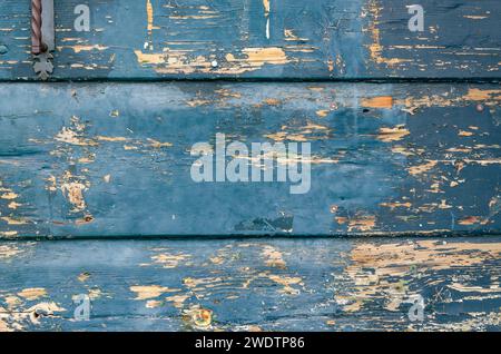 Boards damaged by age and painted green, as a background - close-up Stock Photo