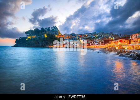 Parga, Greece. Beautiful colorful coastal town in Epirus, Greek holidays. Blue hour sunset illuminated oldtown. Stock Photo