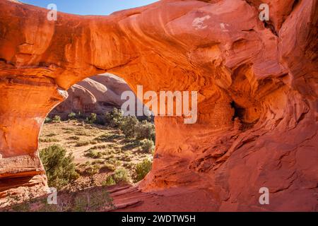 An Ancestral Puebloan ruin inside Honeymoon Arch in Mystery Valley in the Monument Valley Navajo Tribal Park in Arizona. Stock Photo