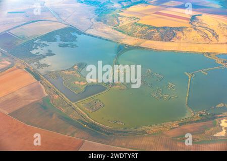 Aerial view of a lake in the middle of the fields. Swamp view from above Stock Photo