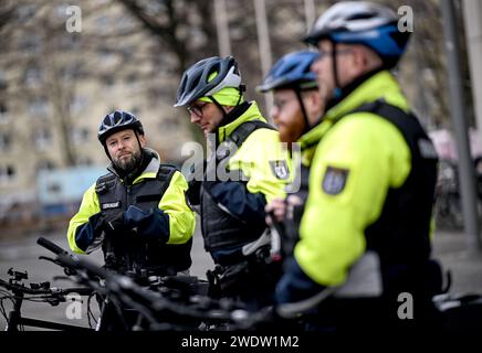 Berlin, Germany. 22nd Jan, 2024. Employees of the bicycle squadron of the public order office in Mitte stand with their bicycles on a cycle path. Their tasks include priority checks to monitor traffic and checks in the protected green areas. The Mitte public order office has a fleet of around 20 bicycles at its disposal for the bicycle patrol. Credit: Britta Pedersen/dpa/Ģ����ý Live News Stock Photo