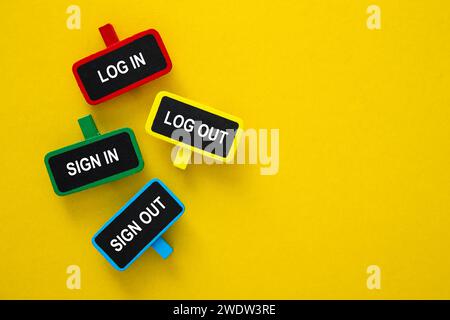 Grouping colorful login sign in out boards on yellow background Stock Photo