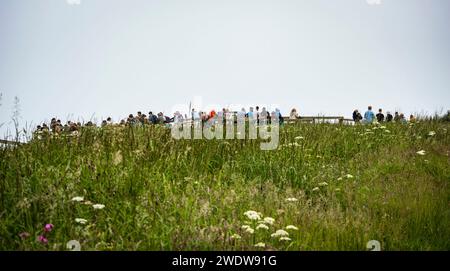 Twitchers, bird watchers and nature lovers gather to see seabirds nesting at Bempton Cliffs, East Yorkshire, UK Stock Photo