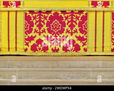 Decorated altar cloth frontal on the main altar in the chancel of the medieval english cathedral at York, England. Stock Photo