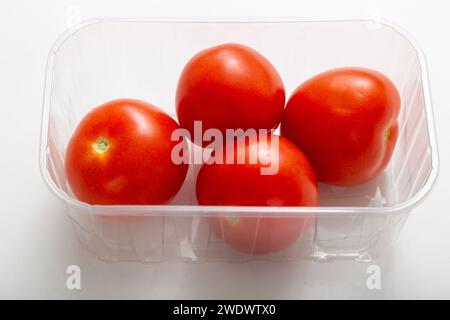 salad tomatoes in plastic punnet Stock Photo