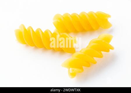 Fusilli are a variety of pasta that are formed into corkscrew or helical shapes. In the United States, corkscrew shaped fusilli are known as rotini Stock Photo