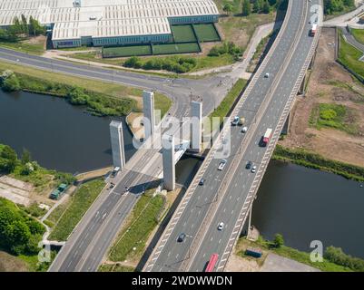 Aerial view of Barton Viaduct carrying the M60 motorway, with Salford Western Gateway lift bridge over the Manchester Ship Canal, UK Stock Photo