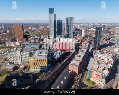 Aerial image of First Street, Deansgate Square residential towers, AXIS, River Street Tower, Rochdale Canal & train line in Manchester city centre, UK Stock Photo