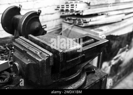 Vice in a locksmith workshop, black and white industrial photo Stock Photo