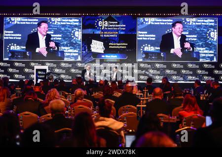 Krakow, Poland. 22nd Jan, 2024. Elon Musk, owner of Tesla and the X (formerly Twitter) platform, speaks with Ben Shapiro during a symposium on fighting antisemitism titled 'Never Again : Lip Service or Deep Conversation' in Krakow, Poland on January 22nd, 2024. Musk, who was invited to Poland by the European Jewish Association (EJA) has visited the Auschwitz-Birkenau concentration camp earlier that day, ahead of International Holocaust Remembrance Day. Credit: ZUMA Press, Inc./Alamy Live News Stock Photo