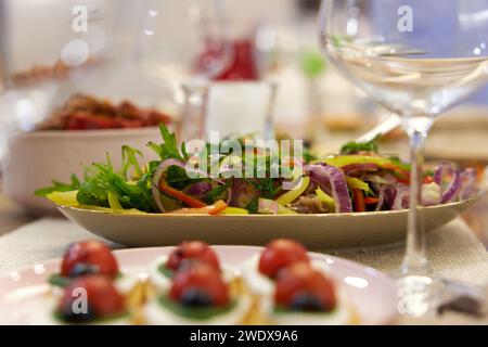 Lady bug cracker with cream cheese and tomato on festive table Stock Photo