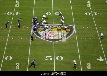 BALTIMORE, MARYLAND, JAN 20: A general overall view as Baltimore Ravens quarterback Lamar Jackson (8) prepares to take the snap against the Houston Texans at midfield on the Ravens logo during the AFC Divisional Playoff game at M&T Bank Stadium on January 20, 2024 in Baltimore, Maryland. The Ravens defeated the Texans 34-10. Stock Photo