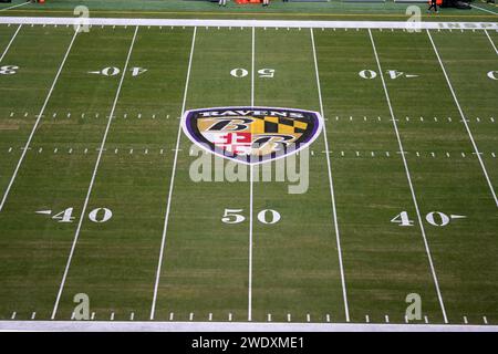 The Baltimore Ravens logo at midfield during the AFC Divisional Playoff game between the Ravens and the Houston Texans at M&T Bank Stadium on January 20, 2024 in Baltimore, Maryland. Stock Photo