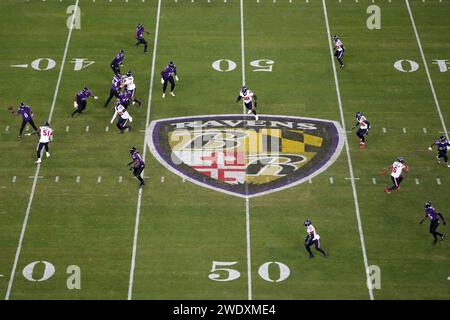 BALTIMORE, MARYLAND, JAN 20: A general overall view as Baltimore Ravens quarterback Lamar Jackson (8) throws the ball against the Houston Texans at midfield on the Ravens logo during the AFC Divisional Playoff game at M&T Bank Stadium on January 20, 2024 in Baltimore, Maryland. The Ravens defeated the Texans 34-10. Stock Photo