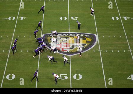 BALTIMORE, MARYLAND, JAN 20: A general overall view as Baltimore Ravens quarterback Lamar Jackson (8) prepares to take the snap against the Houston Texans at midfield on the Ravens logo during the AFC Divisional Playoff game at M&T Bank Stadium on January 20, 2024 in Baltimore, Maryland. The Ravens defeated the Texans 34-10. Stock Photo