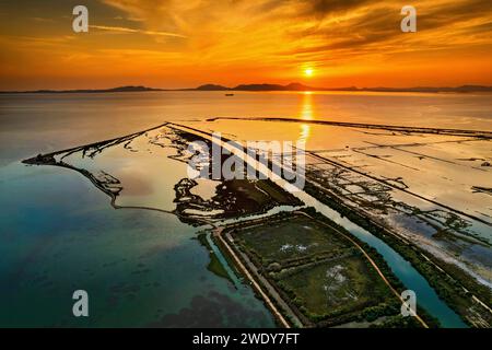 Sunset at the Delta of Kalamas river, Thesprotia, Epirus, Greece. In the background, Kerkyra ('Corfu') island. Stock Photo