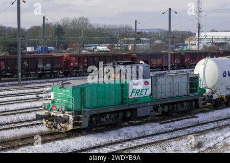 Damelevières, France - Grey and green heavy shunter SNCF Class BB 60000 crossing Blainville - Damelevières station. Stock Photo