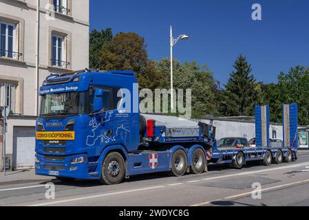 Nancy, France - Blue heavy haulage truck Scania S650 with an empty trailer on the road. Stock Photo