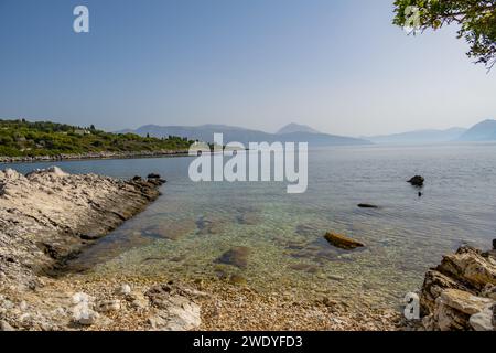 Looking towards the greek mainland from a beach near Elia Beach on the greek island of Meganisi Stock Photo