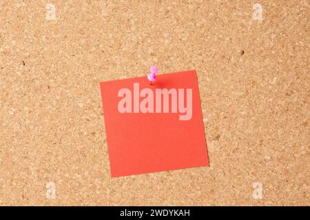 Several multi-colored sheets paper fastened with a paper clip. Stock Photo