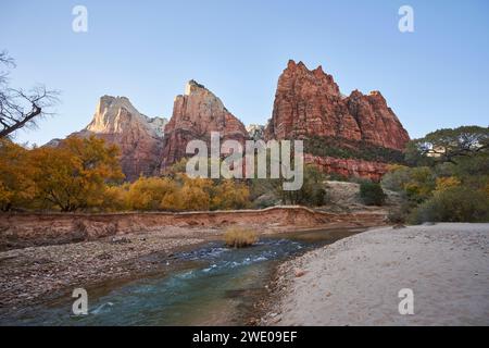 The virgin river flowing through the court of the patriarchs. The three mountains peaks tower over the rivers. Color is everywhere, in the rock, in th Stock Photo