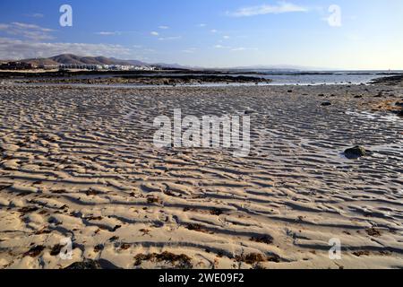 Wave patterns in the sand at low tide, Fuerteventura, Canary Islands. Taken November 2023 Stock Photo