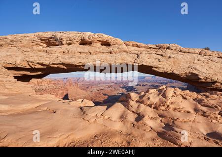 Mesa arch is a 27 foot long pothole arch that frames a beautiful view of the outstretched canyon below. Located in Canyonlands National park, this lan Stock Photo