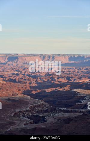 Evening draws in over Canyonlands National Park. The rock surface has been sculpted by the Colorado river, leaving steep cliffs and beautiful contrast Stock Photo