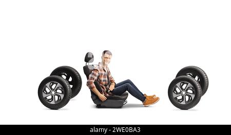 Casual young man buckling up a seat belt in a car on four tires  isolated on white background Stock Photo